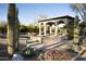 Outdoor pool with desert landscaping and covered patio area for entertaining at 23779 N 91St St, Scottsdale, AZ 85255