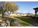 Beautiful tennis court with desert landscaping, mountain views and perimeter lighting at 23779 N 91St St, Scottsdale, AZ 85255
