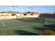 Close up of the community tennis court with pristine surface and net at 23779 N 91St St, Scottsdale, AZ 85255
