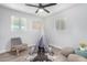 bedroom features a ceiling fan, neutral decor, and playful teepee at 2418 W Flower St, Phoenix, AZ 85015