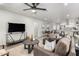 Spacious open-concept living area leading to dining room and modern kitchen, perfect for entertaining at 2418 W Flower St, Phoenix, AZ 85015