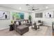 Bright and airy living room featuring a comfortable sectional, contemporary decor, and large windows at 2418 W Flower St, Phoenix, AZ 85015