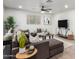 Modern living room with a plush sectional, stylish decor, and plenty of natural light at 2418 W Flower St, Phoenix, AZ 85015