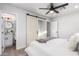 Cozy main bedroom with a sliding barn door leading to the ensuite bathroom at 2418 W Flower St, Phoenix, AZ 85015