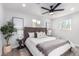 Comfortable main bedroom featuring a ceiling fan and natural light at 2418 W Flower St, Phoenix, AZ 85015