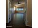 Spacious bedroom featuring hardwood floors, large windows, and an ensuite bathroom at 25532 W Williams W St, Buckeye, AZ 85326