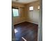 Comfortable bedroom featuring natural light, wood-look floors and a built in niche at 25532 W Williams W St, Buckeye, AZ 85326