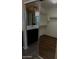 Large walk-in closet featuring ample shelving, mirrored doors, and wood-look floors at 25532 W Williams W St, Buckeye, AZ 85326