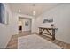 Welcoming foyer with wood-look flooring, console table, neutral paint, and a view of a hallway and other rooms at 25945 W Sands Dr, Buckeye, AZ 85396