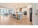 Open kitchen featuring a center island with bar seating and stainless steel appliances, open to the dining room at 25945 W Sands Dr, Buckeye, AZ 85396