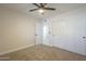 Bedroom with carpet, a ceiling fan and closet at 2641 E Garnet Ave, Mesa, AZ 85204