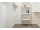 Bright walk-in closet offering ample storage with shelving and hanging space at 2641 E Garnet Ave, Mesa, AZ 85204