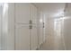 Hallway featuring a linen closet and full bathroom view at 2641 E Garnet Ave, Mesa, AZ 85204