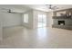 Inviting living room featuring a decorative fireplace, tile flooring, and access to the backyard at 2641 E Garnet Ave, Mesa, AZ 85204