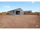 Large backyard view including covered patio on new home with block fence for privacy at 2673 E San Miguel Dr, Casa Grande, AZ 85194