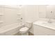 Pristine white bathroom with a shower-tub combo, a modern vanity and a sleek, minimalist design at 2673 E San Miguel Dr, Casa Grande, AZ 85194