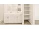 Bathroom featuring a double sink vanity, tile flooring, and shelving at 2673 E San Miguel Dr, Casa Grande, AZ 85194