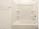 Clean, minimalist white bathtub featuring a shower combo, perfect for a relaxing bath at 2673 E San Miguel Dr, Casa Grande, AZ 85194