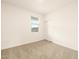 Bright, carpeted bedroom with a window, sliding closet doors, and neutral decor, ready for personalization at 2673 E San Miguel Dr, Casa Grande, AZ 85194