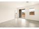Bedroom with neutral tile floors and sliding glass doors to the backyard at 2673 E San Miguel Dr, Casa Grande, AZ 85194