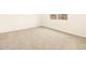 Neutral carpeting fills the room in this straight shot of a bedroom at 2673 E San Miguel Dr, Casa Grande, AZ 85194