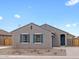 Beautiful single-story home with blue shutters, low-maintenance landscaping, and a well-maintained facade at 2673 E San Miguel Dr, Casa Grande, AZ 85194