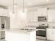 Close-up of the kitchen featuring stainless steel appliances, granite countertops, and white cabinets at 2673 E San Miguel Dr, Casa Grande, AZ 85194