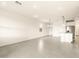 Open-concept living room with tile flooring and modern pendant lighting at 2673 E San Miguel Dr, Casa Grande, AZ 85194