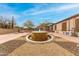 Beautiful desert landscaping with a fountain creating a relaxing atmosphere at 32177 N Echo Canyon Rd, San Tan Valley, AZ 85143