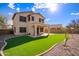 Back of home featuring an extended patio and green artificial turf at 3621 W Keller Ct, Anthem, AZ 85086