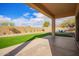 Covered patio area with artificial grass and desert landscaping at 3621 W Keller Ct, Anthem, AZ 85086