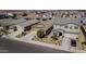 Aerial view of a residential neighborhood showcasing well-maintained homes and desert landscaping at 36602 W San Alvarez Ave, Maricopa, AZ 85138