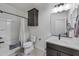 Clean bathroom featuring a shower-tub combo, a modern vanity, and tiled flooring at 36602 W San Alvarez Ave, Maricopa, AZ 85138