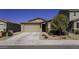 Charming single-story home featuring a two-car garage and well-maintained desert landscaping at 36602 W San Alvarez Ave, Maricopa, AZ 85138