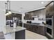 Spacious kitchen featuring a large island, stainless steel appliances, and ample storage space at 36602 W San Alvarez Ave, Maricopa, AZ 85138