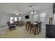 Open-concept living and dining area with comfortable seating and ample natural light at 36602 W San Alvarez Ave, Maricopa, AZ 85138