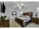 Bright bedroom with large windows, a ceiling fan, and well-crafted wood furniture at 36602 W San Alvarez Ave, Maricopa, AZ 85138