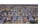 Aerial view of a neighborhood featuring numerous homes with consistent architectural style and landscaping at 36602 W San Alvarez Ave, Maricopa, AZ 85138