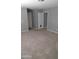 Large carpeted bedroom with access to two doorways at 374 S Verdad Ln, Casa Grande, AZ 85194