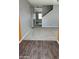 A bright entryway with light gray walls, neutral carpet, and wood-look flooring at 374 S Verdad Ln, Casa Grande, AZ 85194