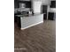 A modern kitchen with stainless steel appliances and dark cabinets at 374 S Verdad Ln, Casa Grande, AZ 85194