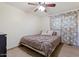 Bedroom with a bed, ceiling fan and carpet at 416 W Chambers St, Phoenix, AZ 85041