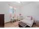 Small bedroom featuring a white bed, dresser and pink curtains at 416 W Chambers St, Phoenix, AZ 85041