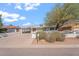 This angle highlights the house, featuring its fenced yard, carport, and inviting curb appeal at 416 W Chambers St, Phoenix, AZ 85041