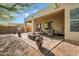 Back patio with a built in grill and seating, ideal for outdoor entertaining at 42823 N Courage Trl, Anthem, AZ 85086