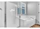 Bathroom featuring a glass enclosed shower and a large soaking tub at 42823 N Courage Trl, Anthem, AZ 85086