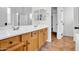 Bathroom with double sinks and wood cabinets at 42823 N Courage Trl, Anthem, AZ 85086