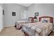 Bright bedroom featuring two twin beds with matching quilts and wooden headboards at 42823 N Courage Trl, Anthem, AZ 85086