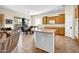 Bright kitchen featuring a dining area, tile floors, and a seamless connection to the living room at 42823 N Courage Trl, Anthem, AZ 85086
