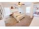 Bedroom with a ceiling fan, natural light from the window, and an adjacent dining area at 440 E March St, San Tan Valley, AZ 85140